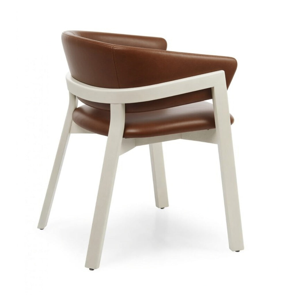 Brown leather-look arm chair with white base, rounded backrest and padded seat