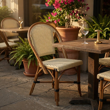 Woven side chair with beige seat and back, dark dot pattern, tan wood legs