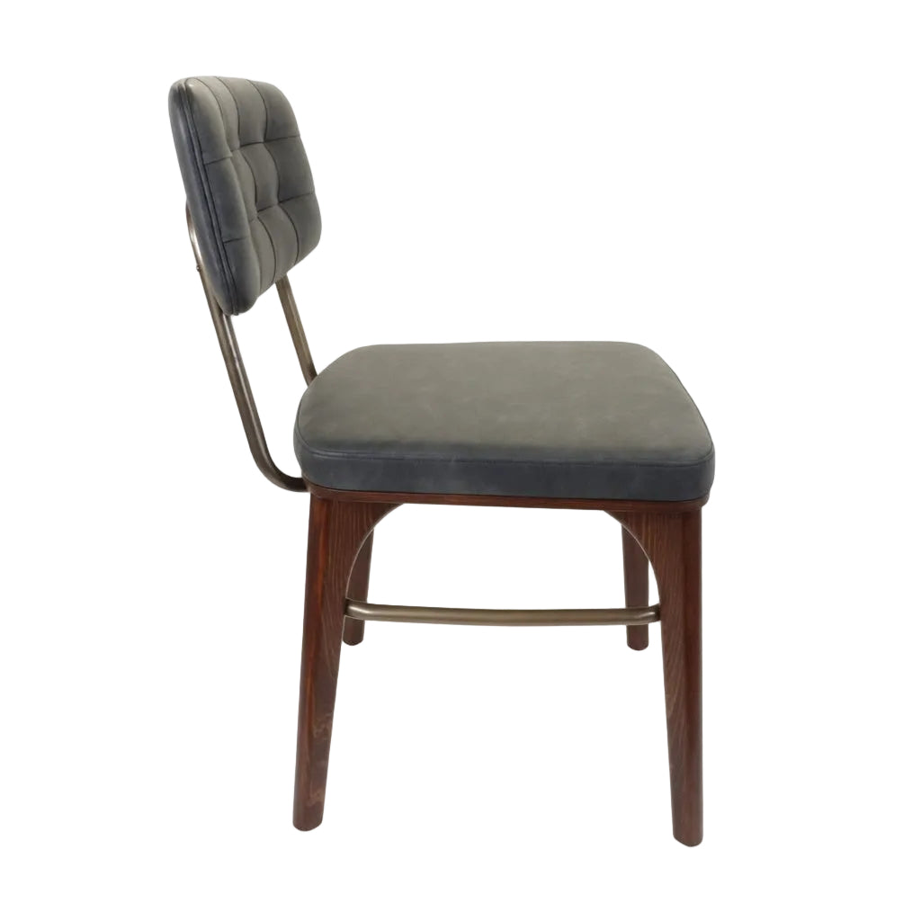 Dark gray upholstered side chair with tufted back and light wood legs