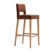 Brown leather bar stool with tall backrest and light oak legs, straight footrest.