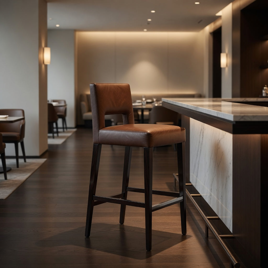Brown leather bar stool with tall backrest and dark wood frame, tapered legs.