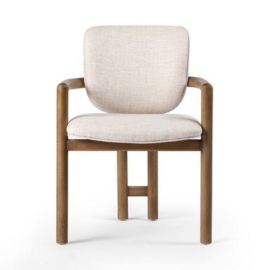 Madeira three-legged dining chair featuring a tubular frame and a curved barrel backrest in cream upholstery, showcasing its sculptural mid-century modern design for luxury dining rooms