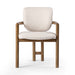 Madeira three-legged dining chair featuring a tubular frame and a curved barrel backrest in cream upholstery, showcasing its sculptural mid-century modern design for luxury dining rooms