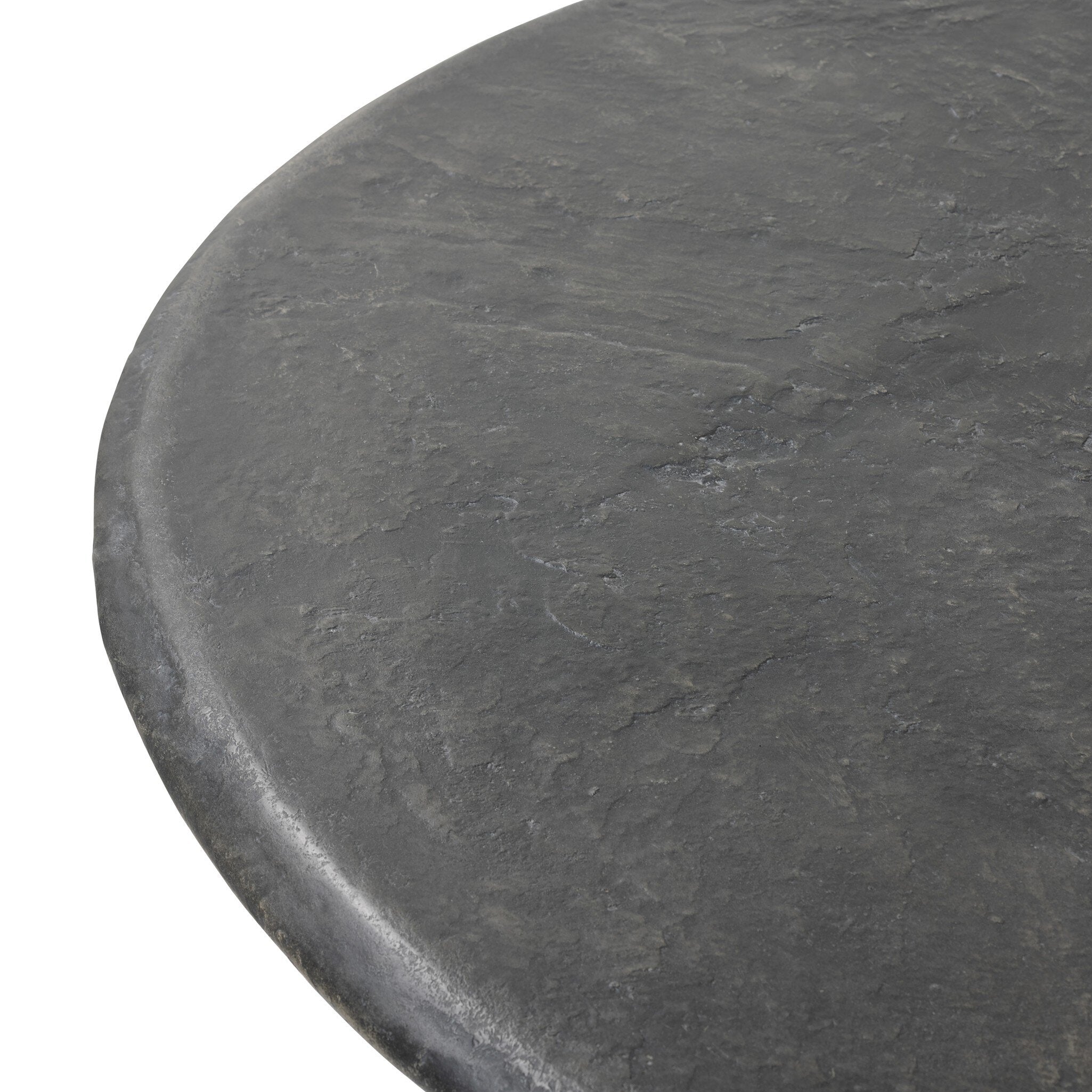 Bonnie dining table 48.5 in round top close-up, textured black concrete surface