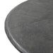 Bonnie dining table 48.5 in round top close-up, textured black concrete surface