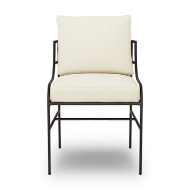 Cream padded outdoor dining chair with dark metal back supports, front view.
