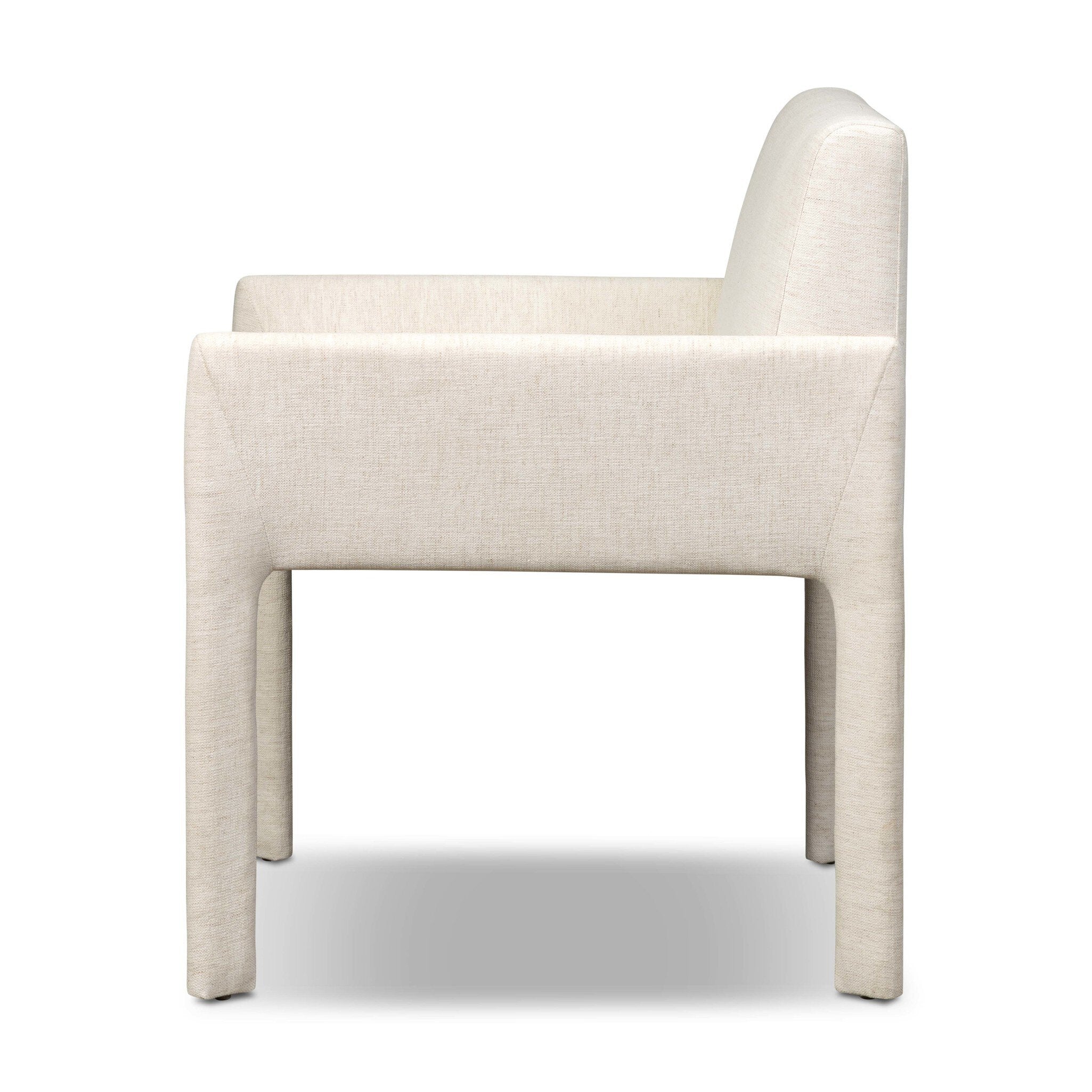 Off-white upholstered dining chair back panel with squared edges and tapered legs.