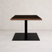 Pedestal table base with dark column and rectangular base plate, centered