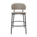 Taupe upholstered bar stool with rounded back, cushioned seat, black metal footrest ring