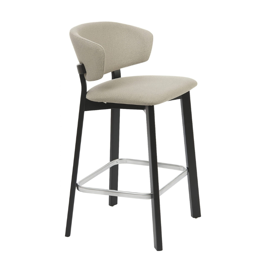 Taupe upholstered bar stool with black legs and chrome footrest