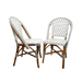 Pair of Nautilus side chairs with white-gray woven seats, curved backs, light wood legs