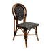 Woven side chair with warm wood frame, black and cream lattice seat and back.