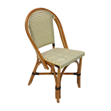 Rattan side chair with curved arms, woven beige back and seat with black dot pattern