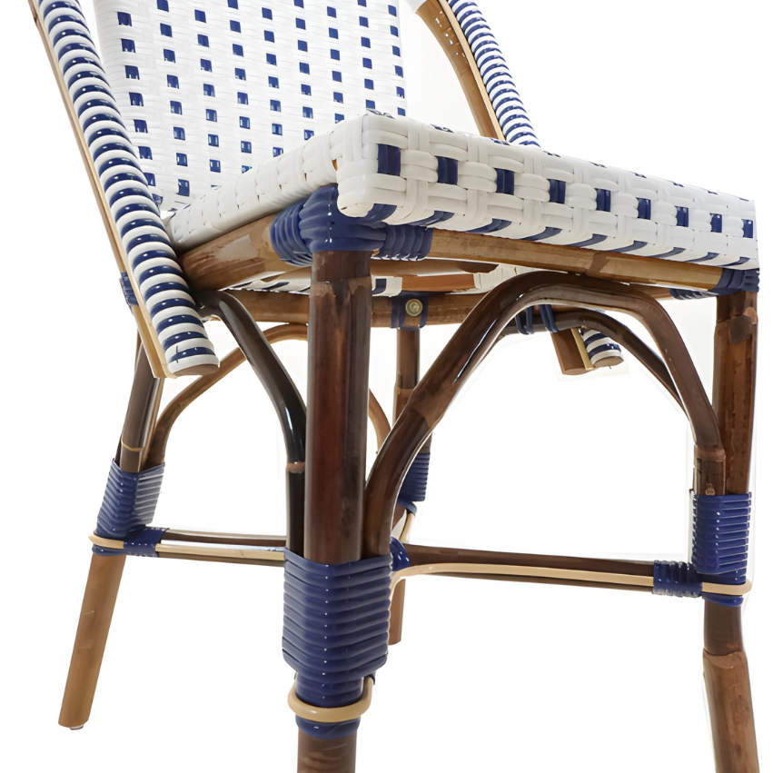 Close-up of side chair arm and base, showing woven seat edge and blue wraps