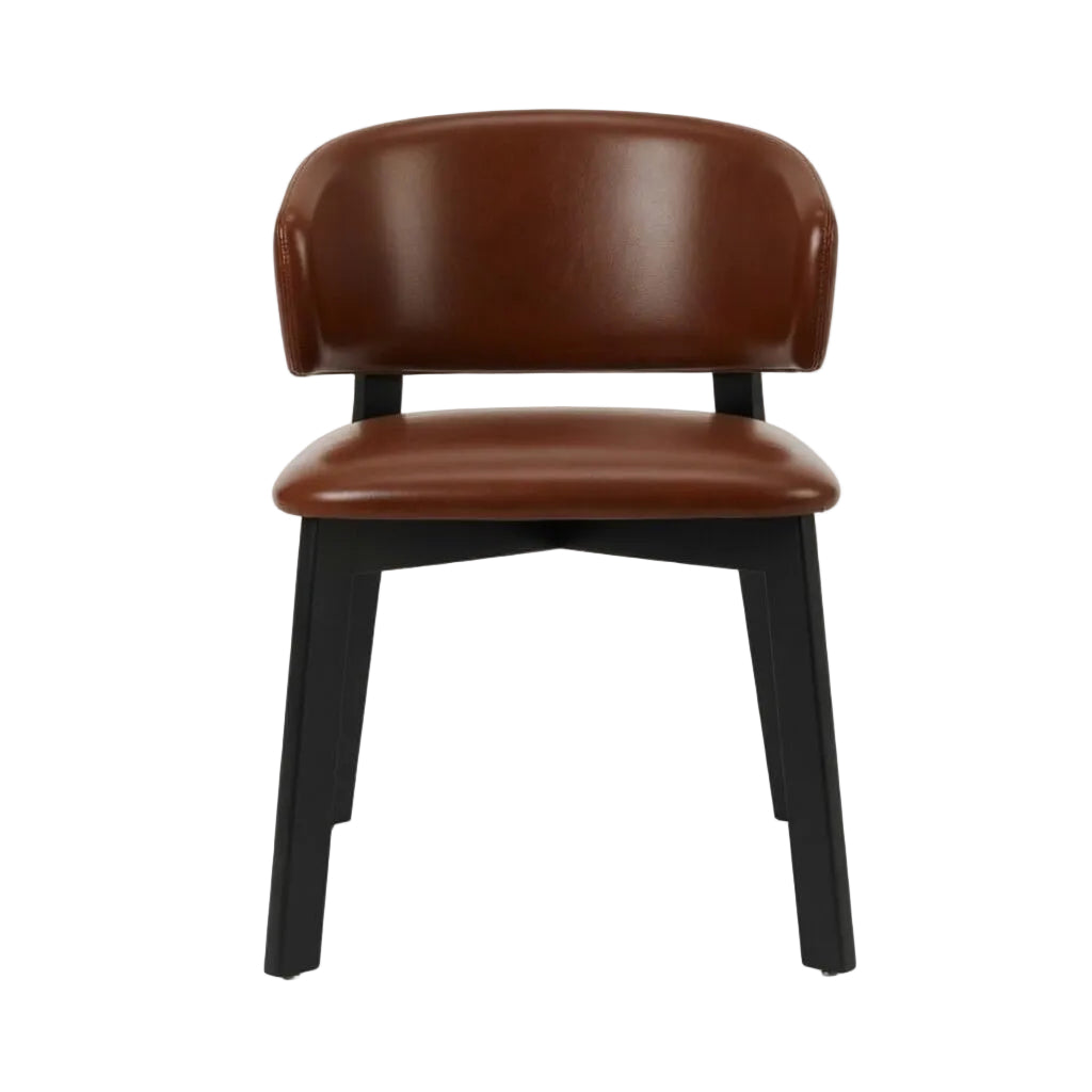 Editor side chair with brown upholstered seat and rounded back, black legs