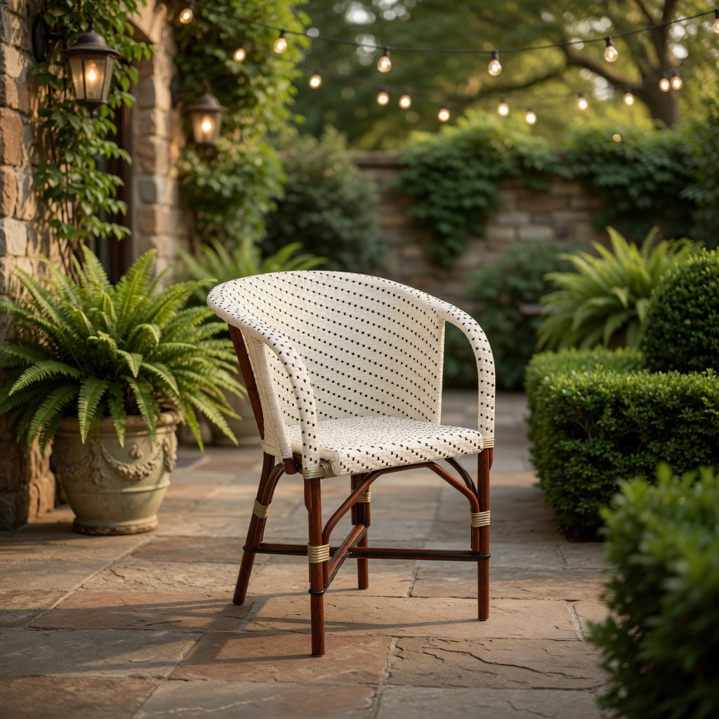 Woven arm chair with cream seat and back, dark stripe pattern, curved armrests.