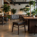 Dark gray upholstered side chair with tufted back and metal legs