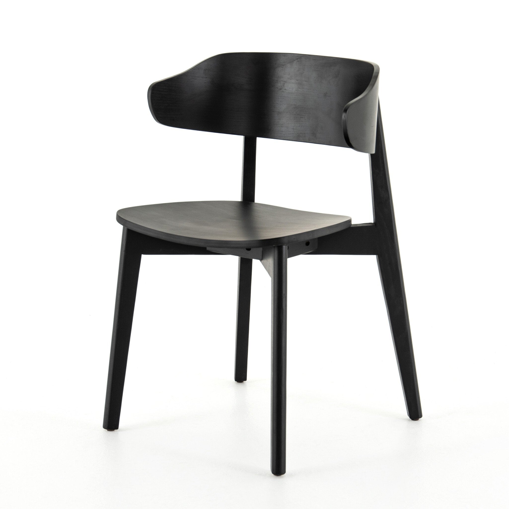 Black armless dining chair with curved backrest and round seat, angled front view