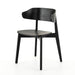 Black armless dining chair with curved backrest and round seat, angled front view