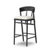 Bar stool with curved black upholstered back and cream padded seat