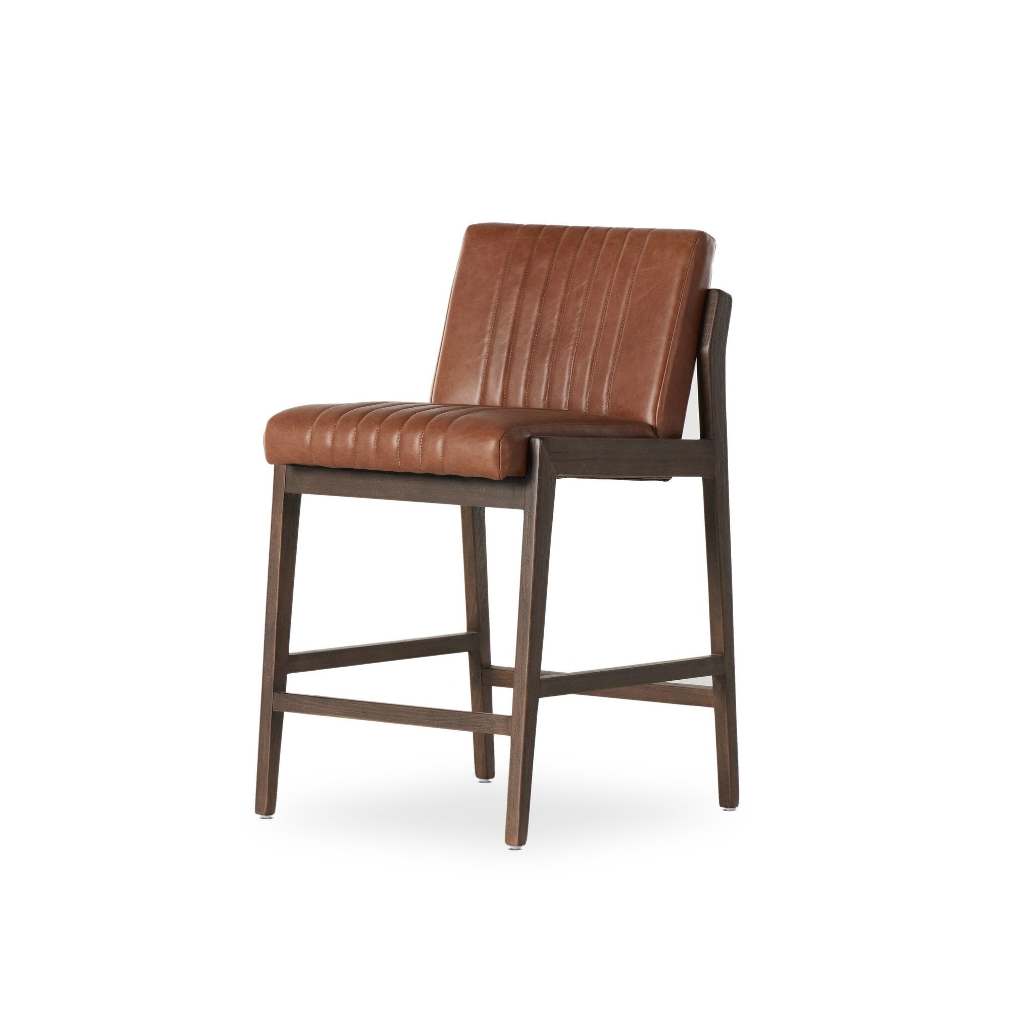 Brown upholstered counter stool with vertical channel seams and dark wood legs, angled view