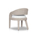 Angled Hawkins Outdoor Dining Chair in Faye Cream with a barrel-back cutout and woven frame