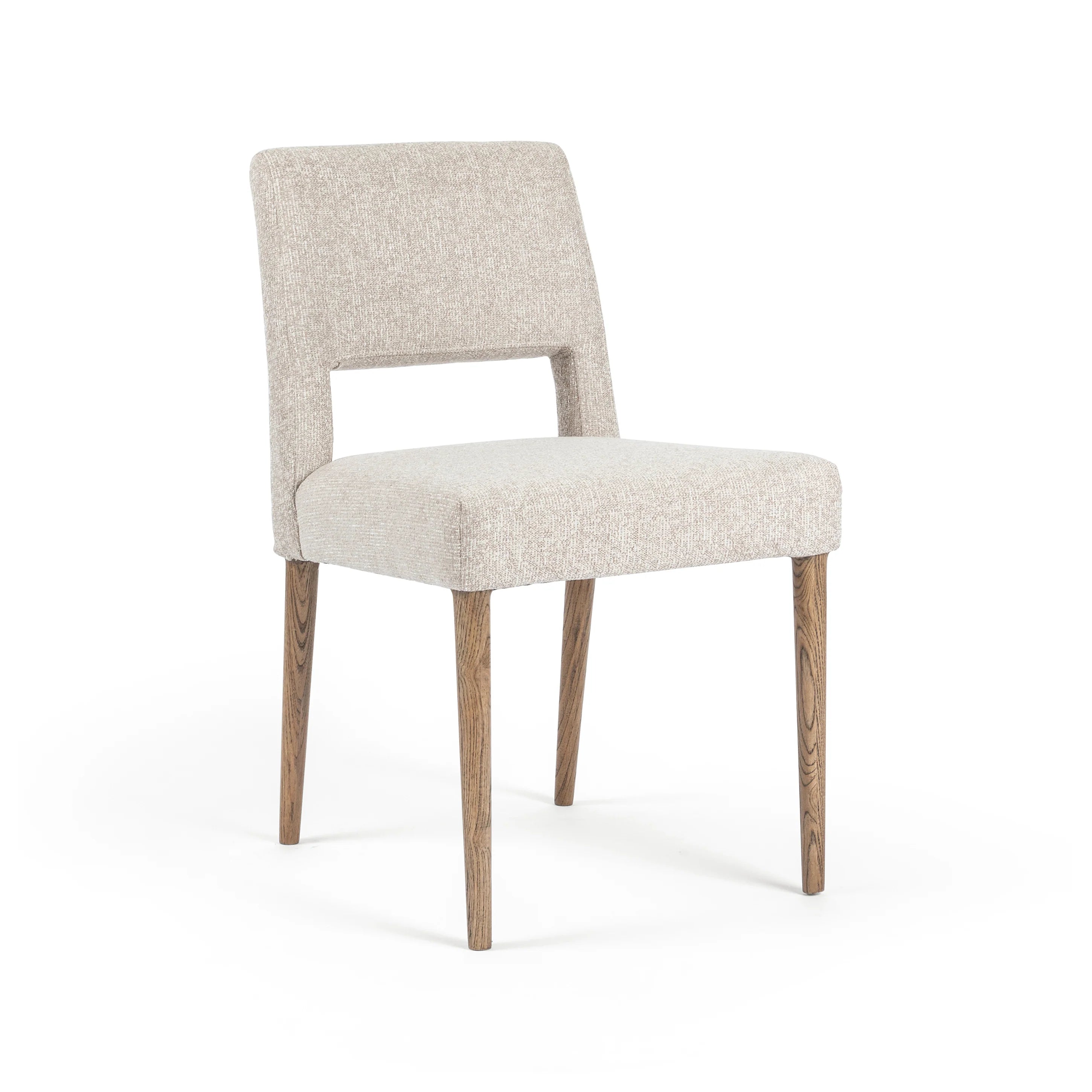 Armless dining chair with light camel textured upholstery, padded seat, and wooden legs.