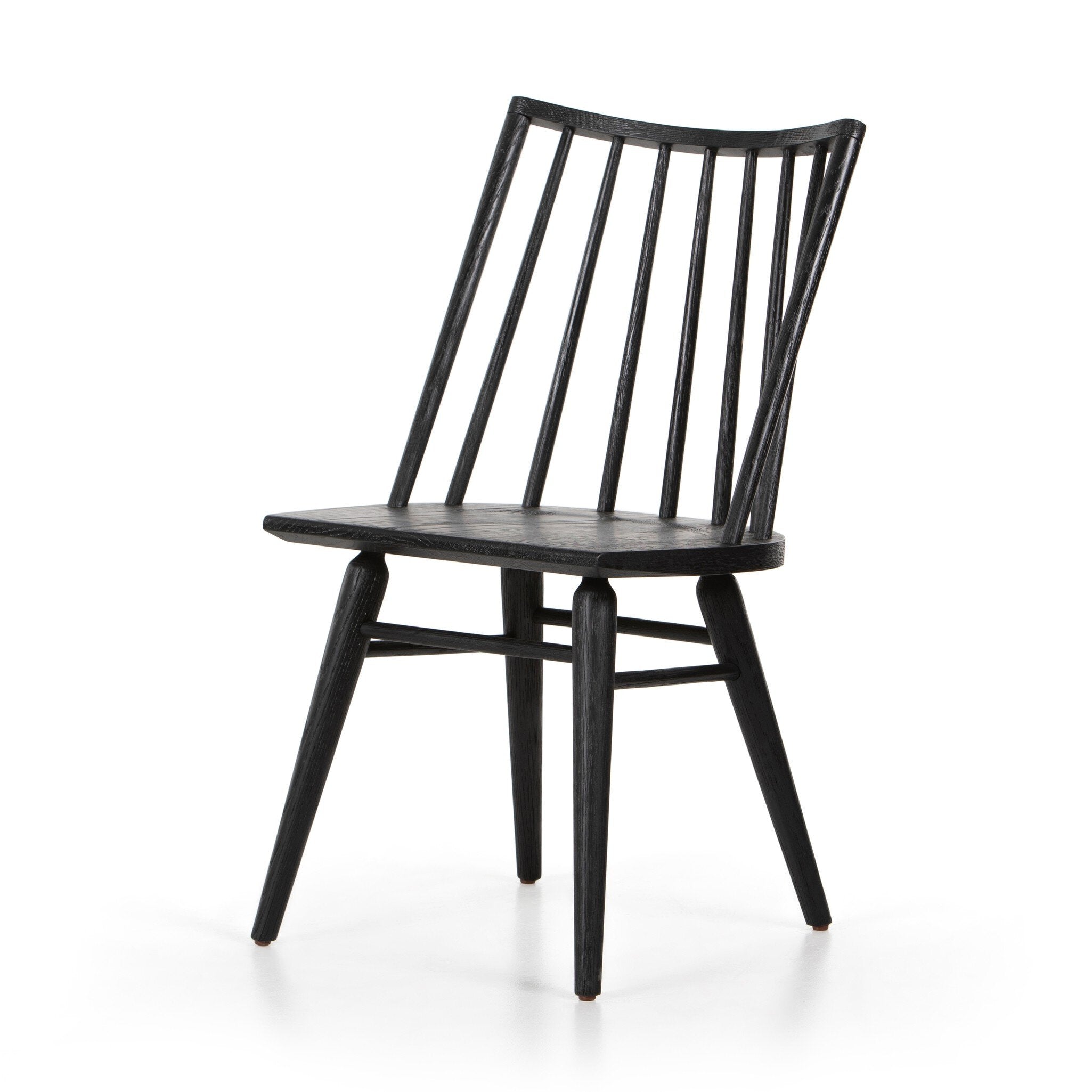 Black armless dining chair with tall slatted back, contoured round-edged seat, dark wood