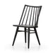 Black armless dining chair with tall slatted back, contoured round-edged seat, dark wood