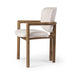 Angled Madeira three-legged dining chair featuring a tubular frame and a curved barrel backrest in cream upholstery