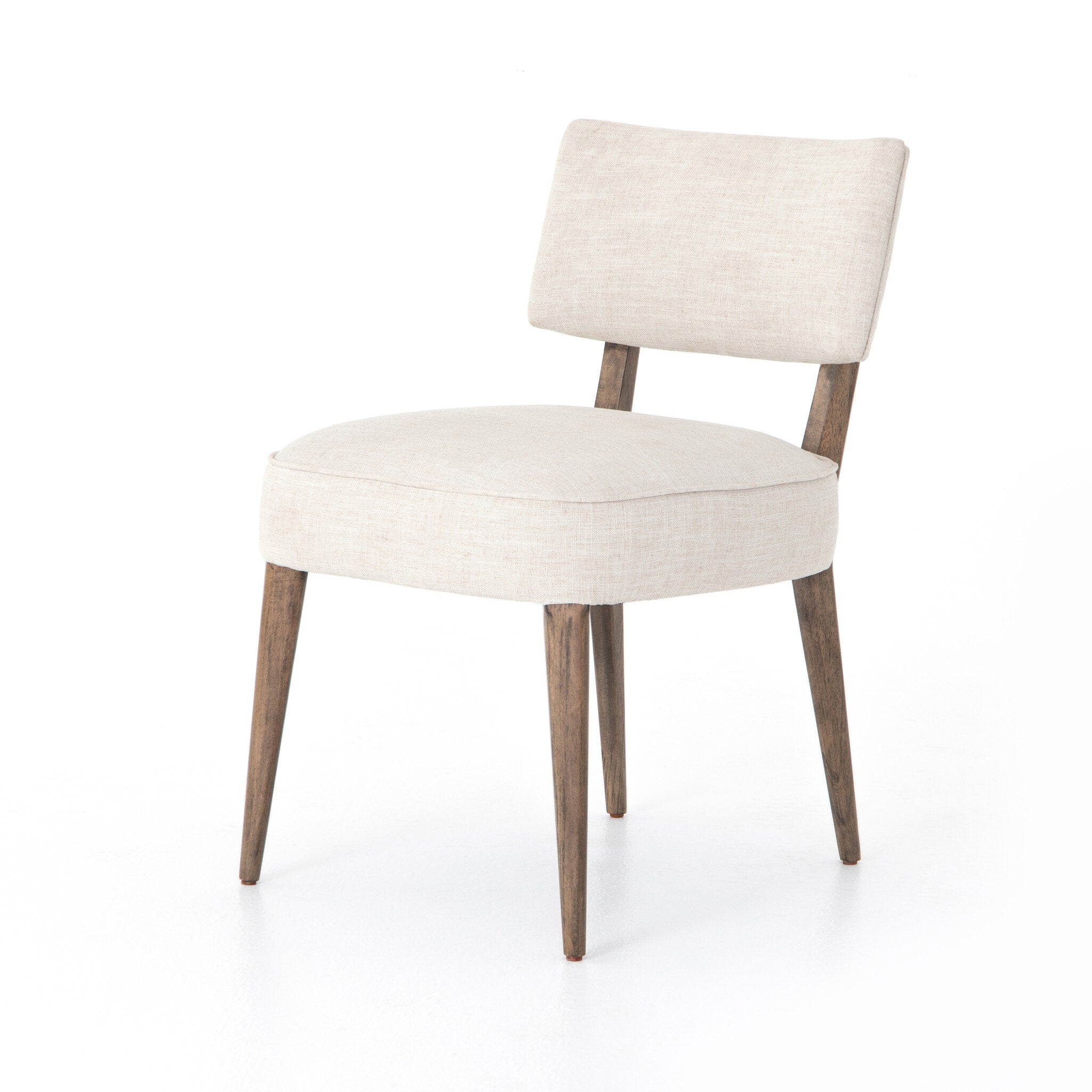 Angled Orville Dining Chair in Cambric Ivory performance fabric with natural parawood legs