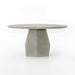 Angled Outdoor Dining Table with a round white concrete top and tapered pedestal base