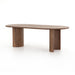 Angled Paden Dining Table in Seasoned Brown Acacia with crescent-shaped legs and an oval tabletop