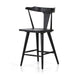 Black oak counter stool with contoured back, round-edged seat, and tapered legs