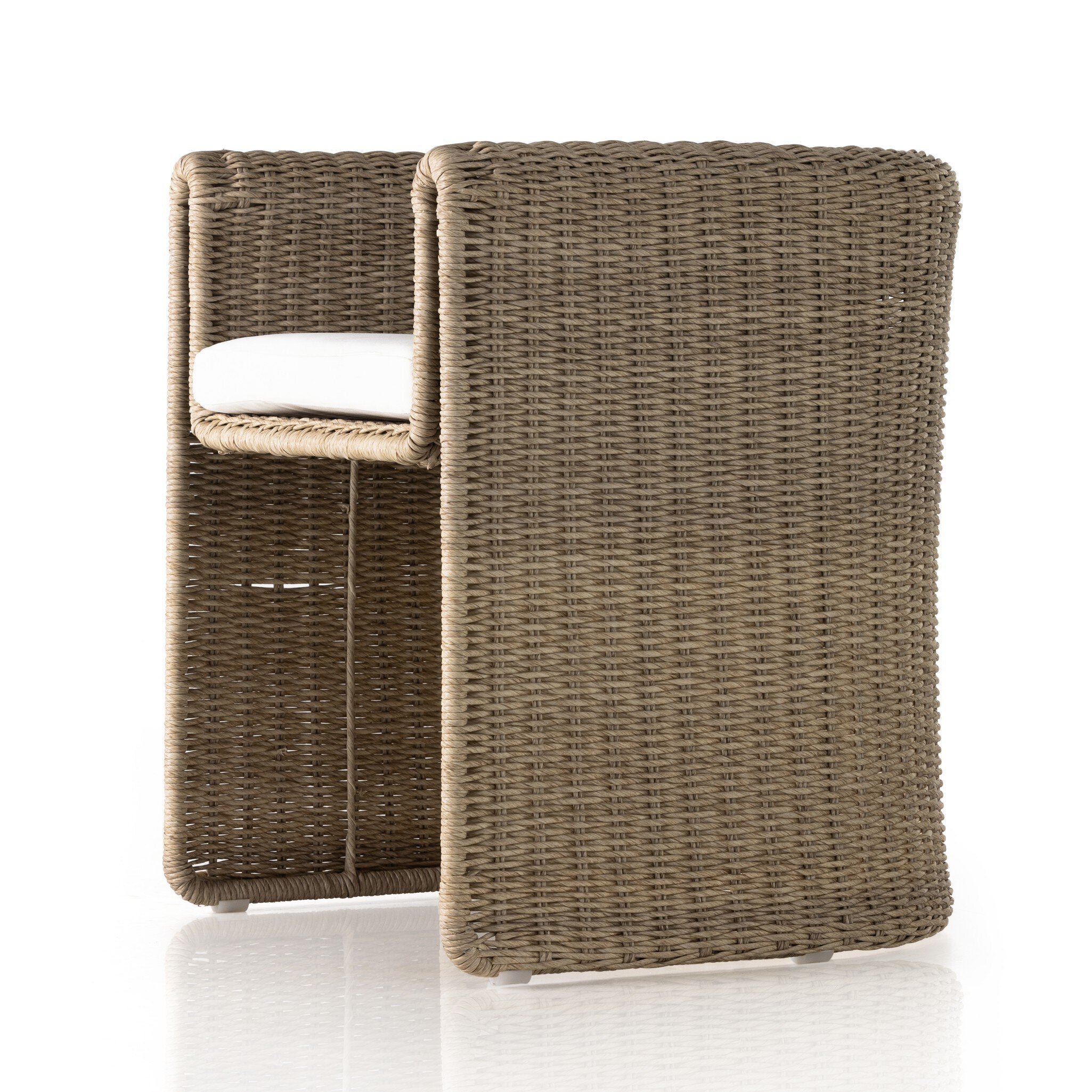 Angled Tucson Outdoor Dining Chair with woven wicker frame and Stinson White cushions
