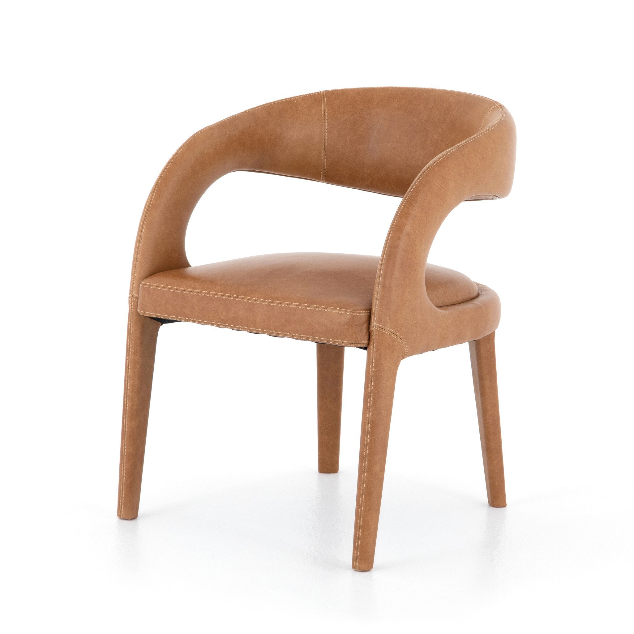 Angled View Hawkins Dining Chair in Sonoma Butterscotch top-grain leather with a sculpted open-back frame.