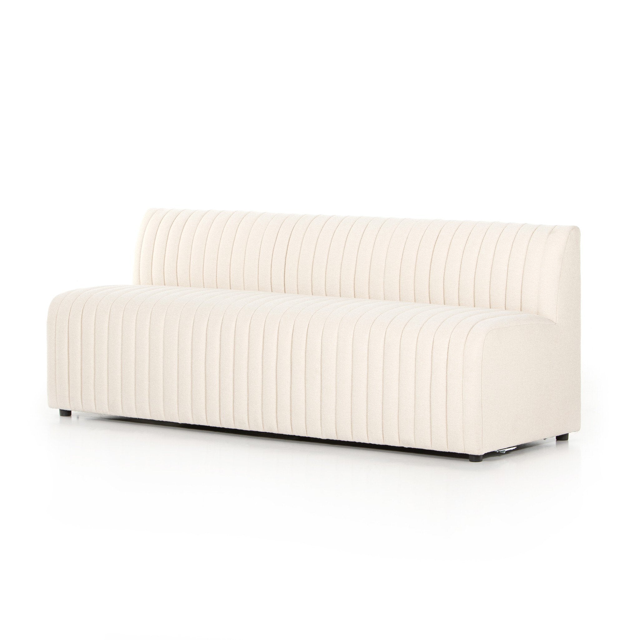 Angled center Custom Augustine dining banquette in neutral performance fabric with high-back tufted detailing and wood base.