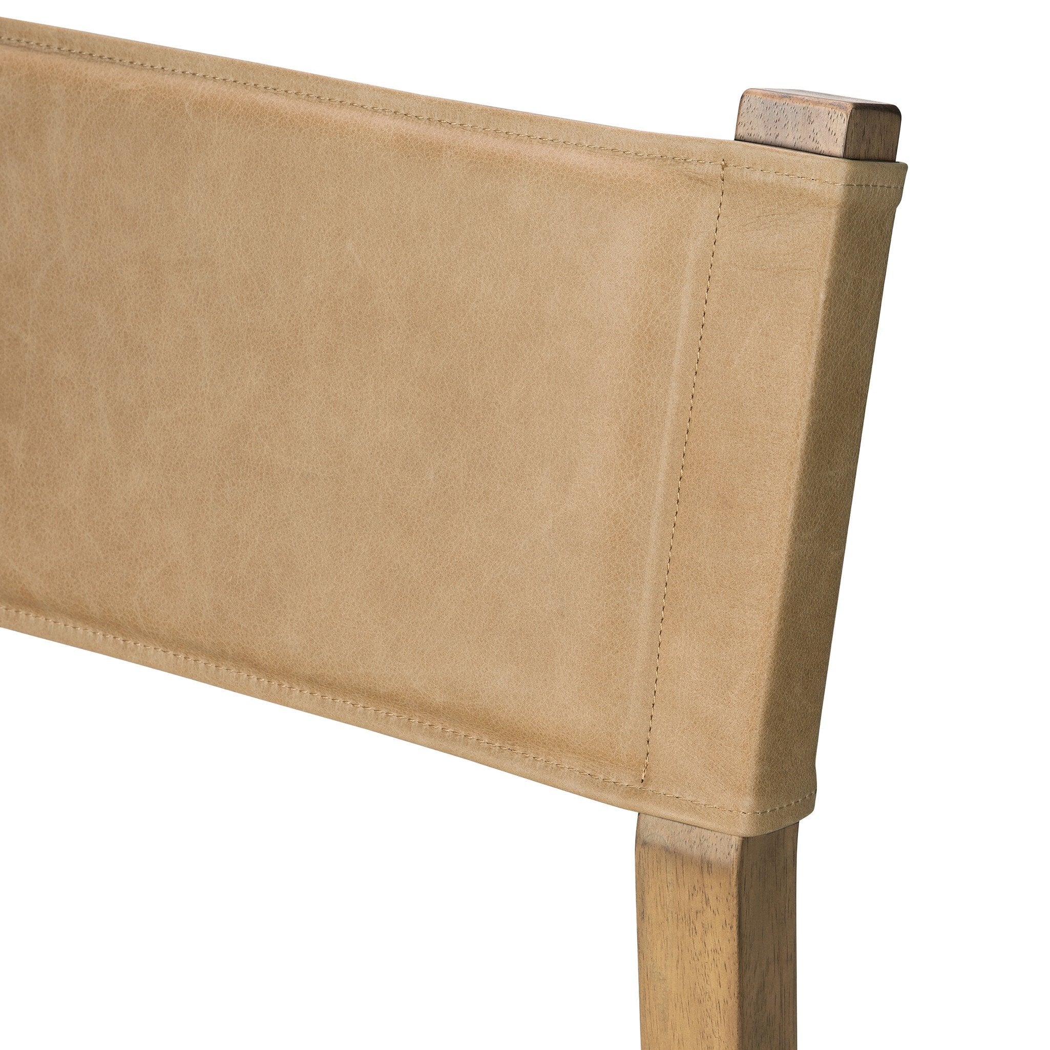 Tan leather-look backrest corner with stitching on cream counter stool