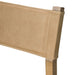 Tan leather-look backrest corner with stitching on cream counter stool