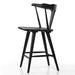 Black oak counter stool side view with curved backrest, front rail, and footrest bar
