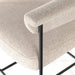 Light camel fabric cushion edge with black metal leg on counter stool