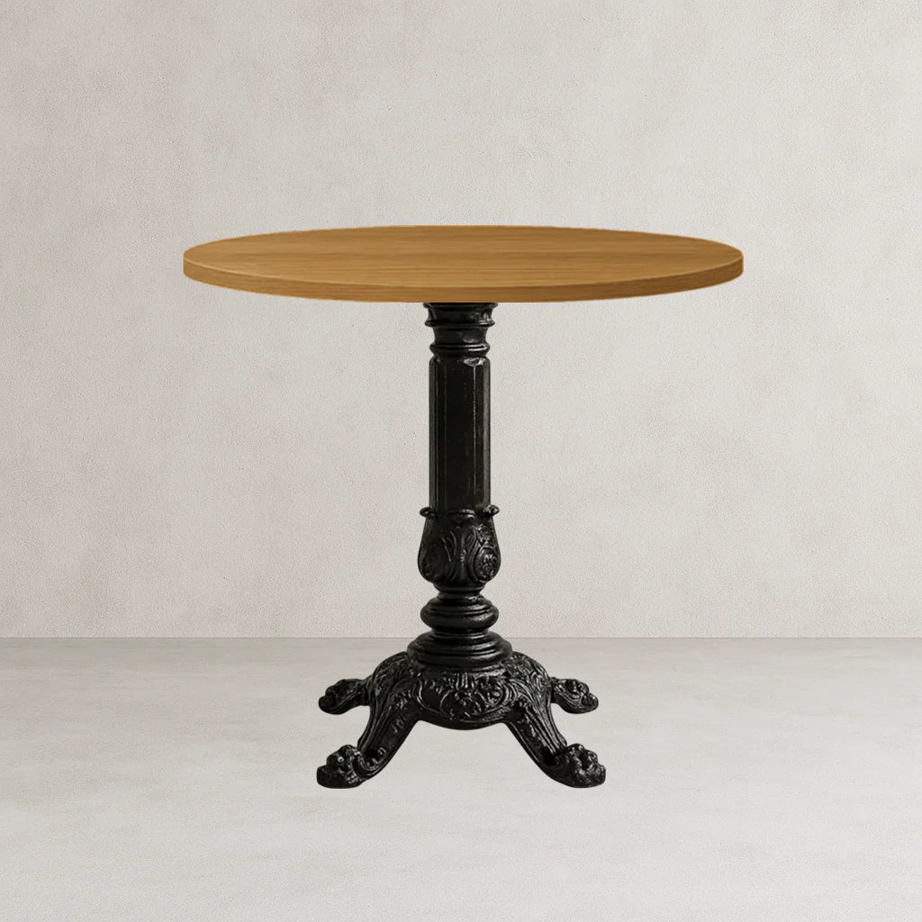Black cast table base with round wooden tabletop and ornate tripod legs