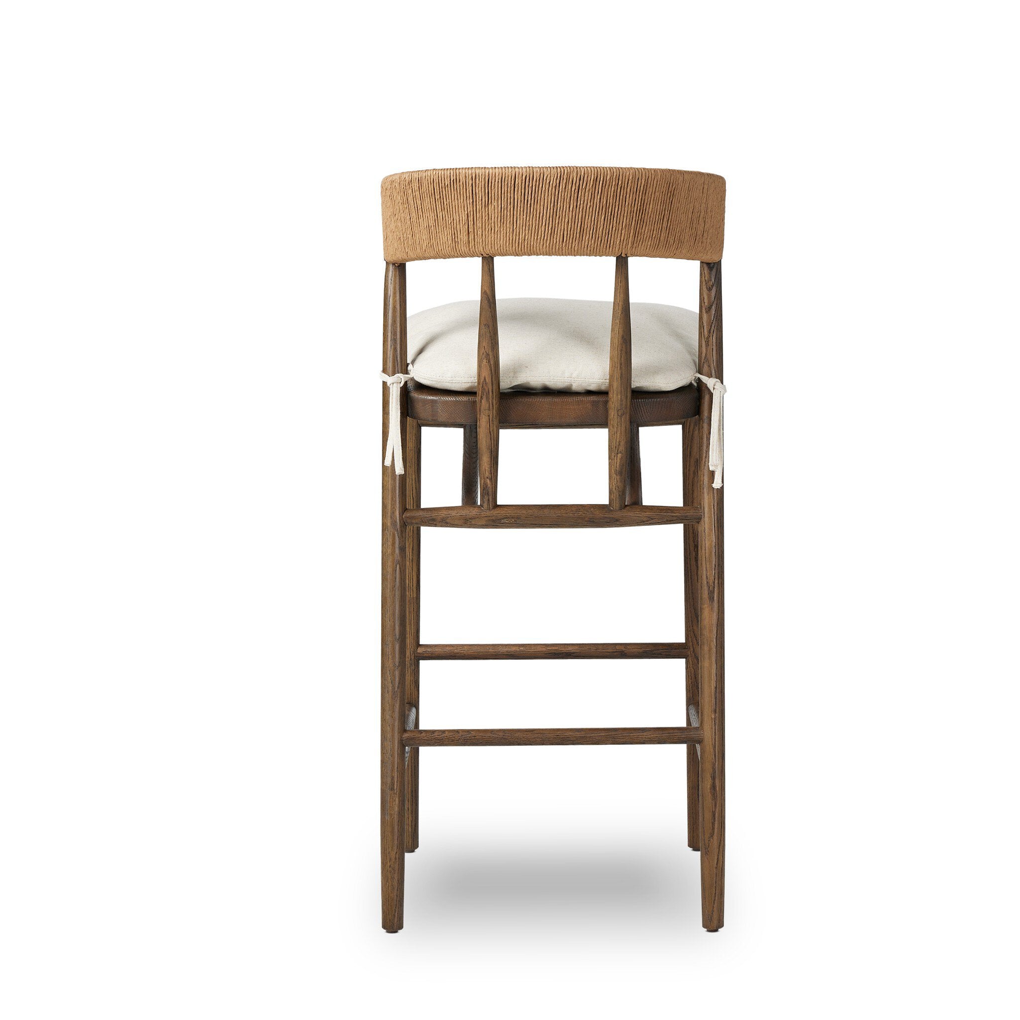 Brown wood bar stool with light seat cushion and front stretcher frame