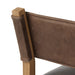 Armless dining chair side view with brown upholstery and square wooden legs