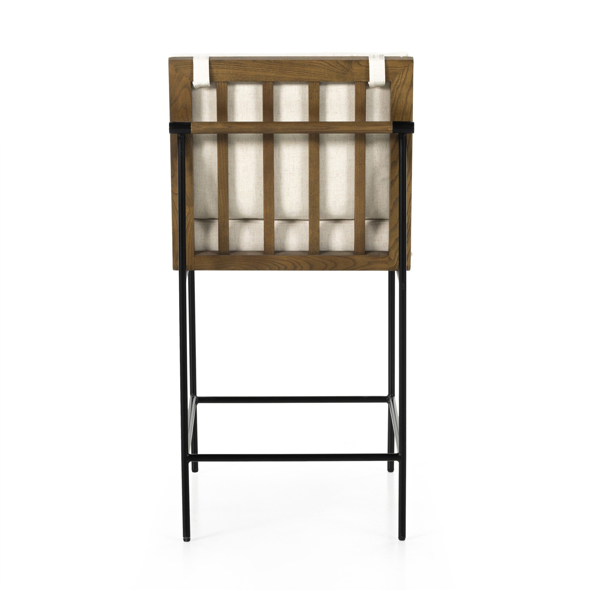 Counter stool with cream cushioned back and seat, wood-and-black frame, and metal footrest