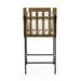 Counter stool with cream cushioned back and seat, wood-and-black frame, and metal footrest