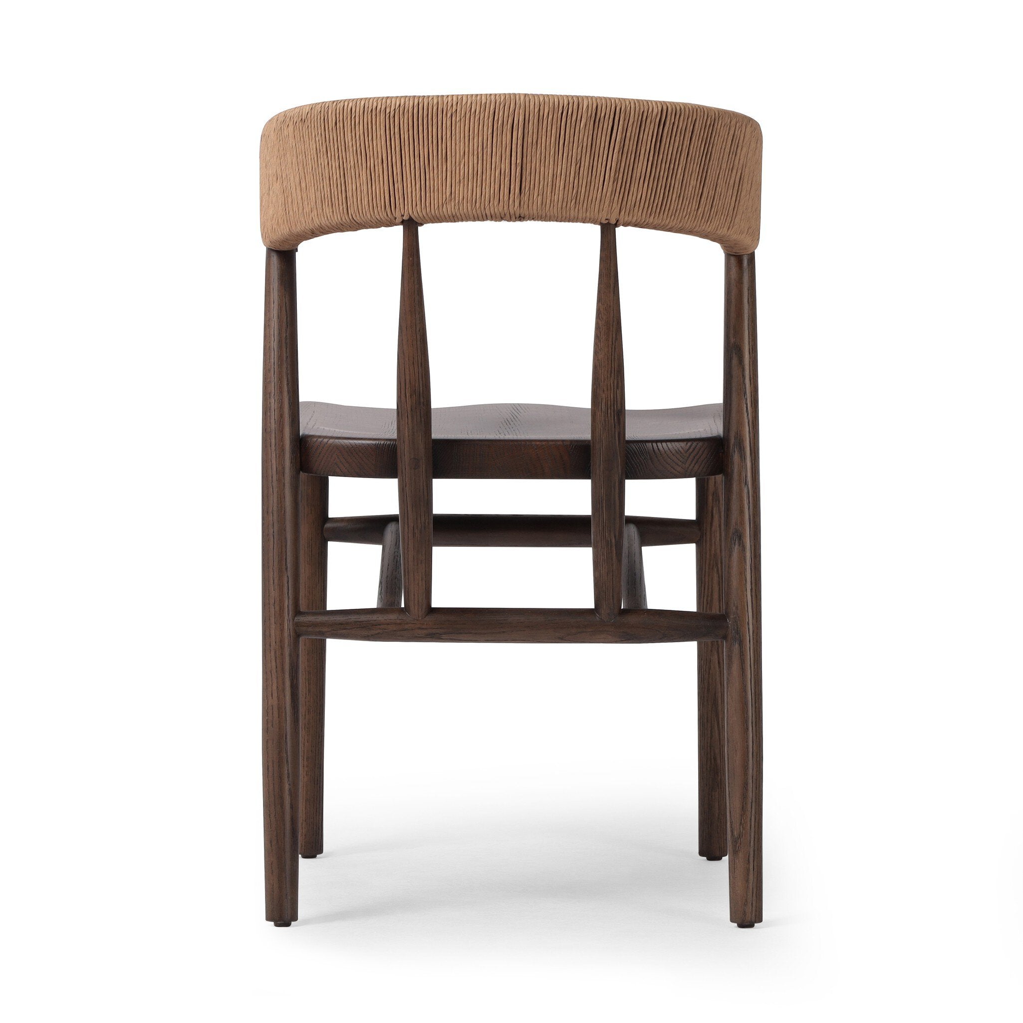 Back view A solid oak dining chair with a paper rush wrapped detail on the back, tapered legs, and a dark finish.