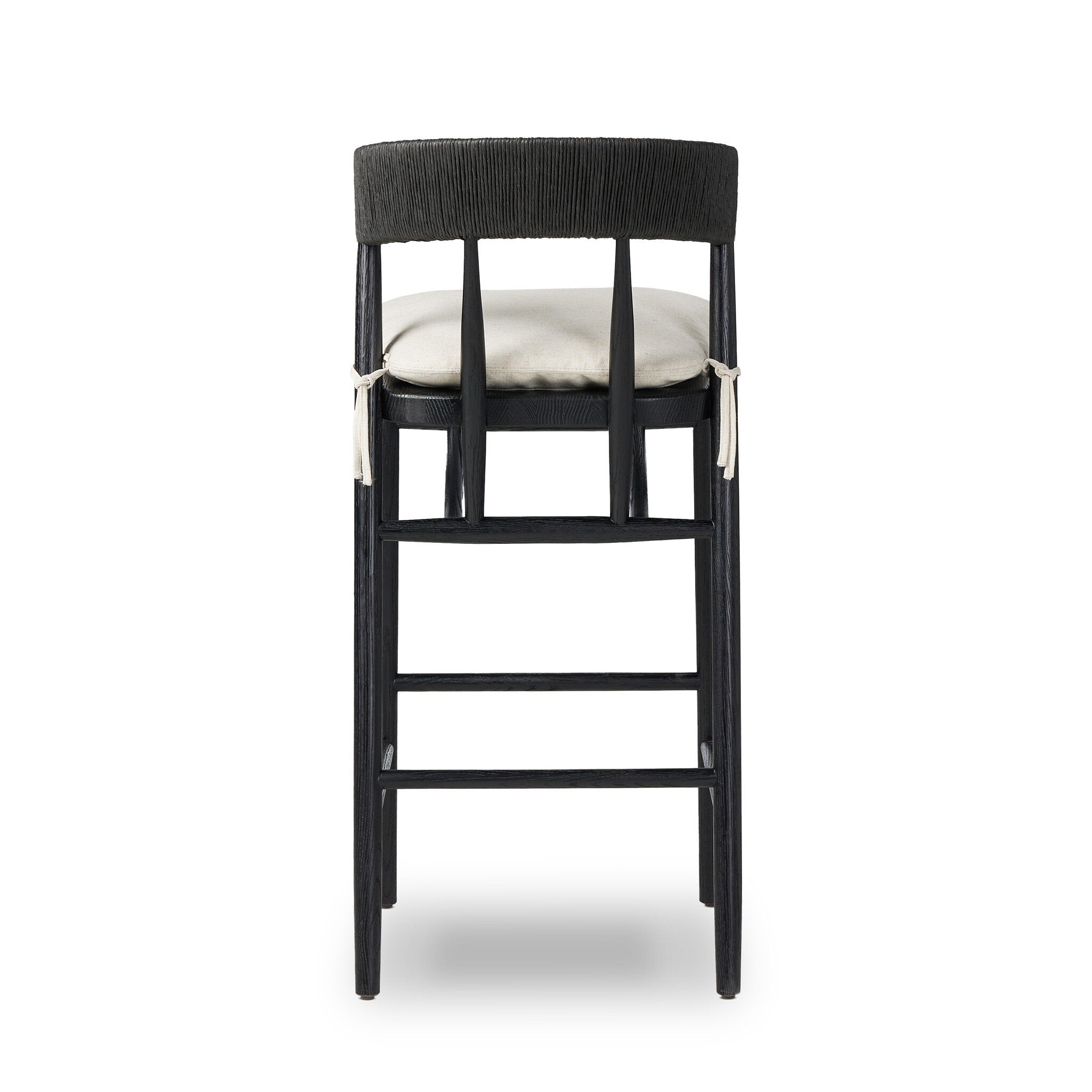 Bar stool front view with black frame, rounded upholstered back, and cream cushion
