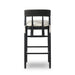 Bar stool front view with black frame, rounded upholstered back, and cream cushion