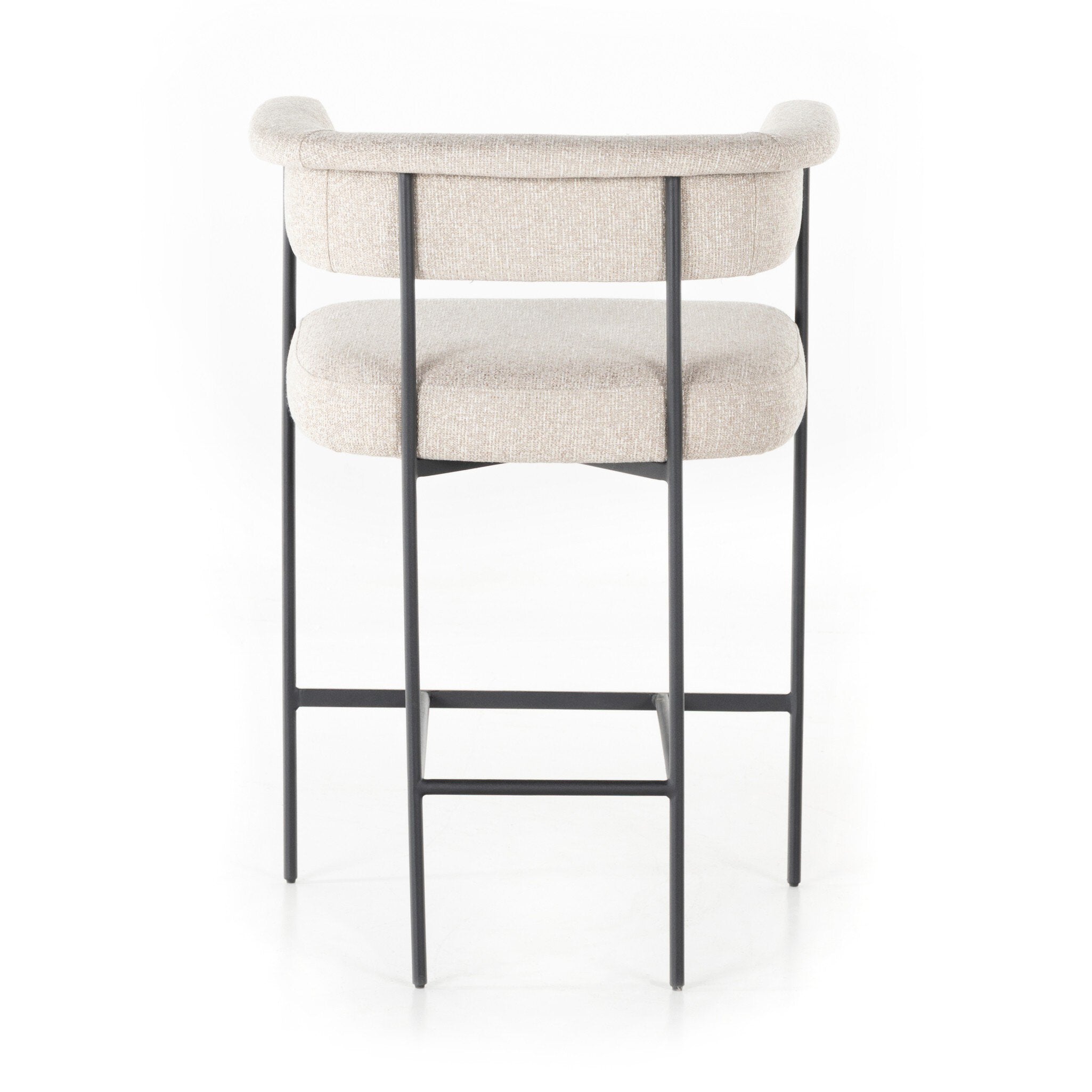 Upholstered counter stool with light camel fabric seat and back pad; black metal legs